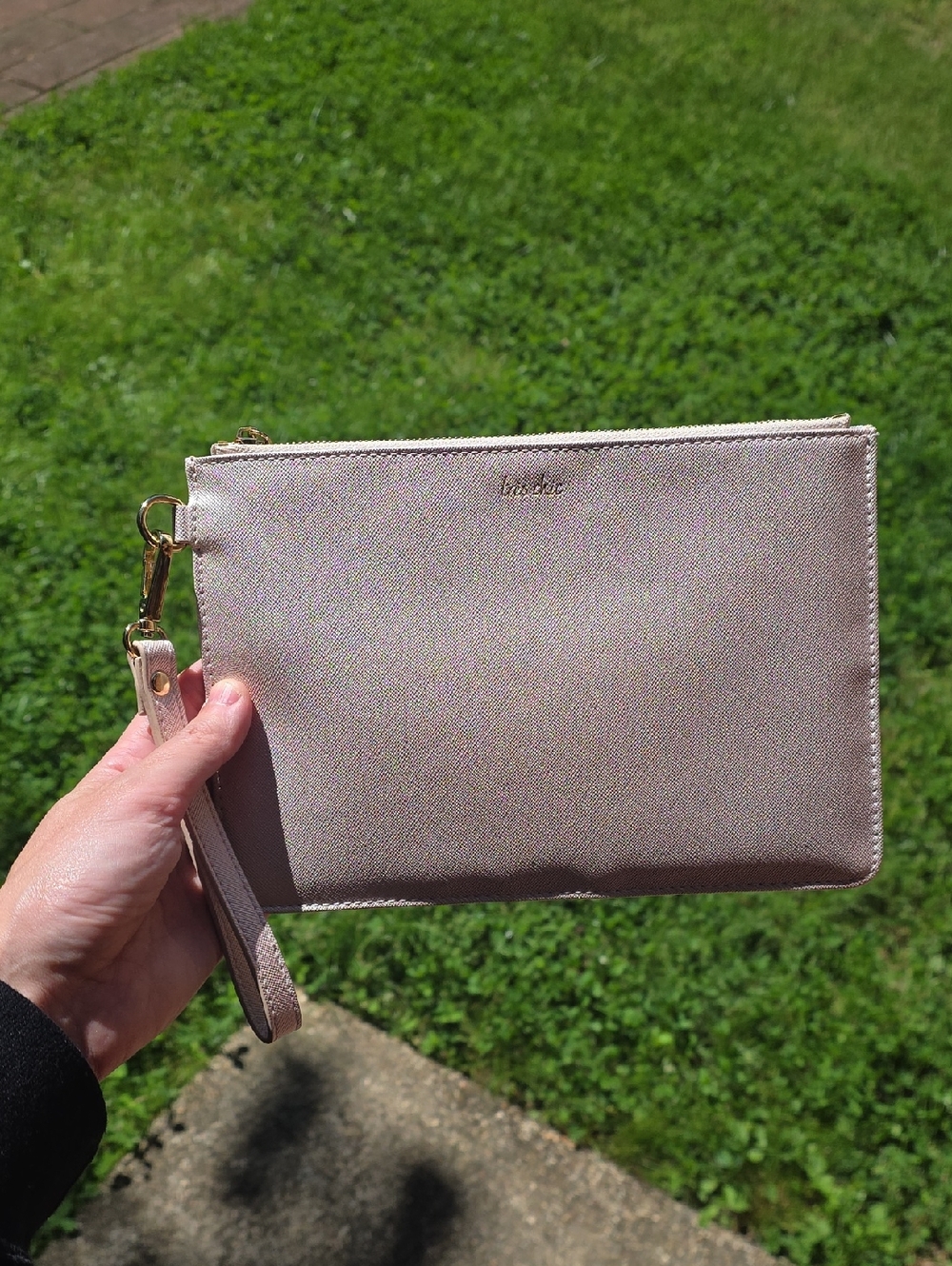 Blush pink wristlet clutch with gold hardware